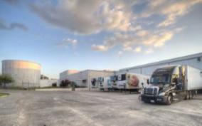 Tractor-trailers at a large storage facility